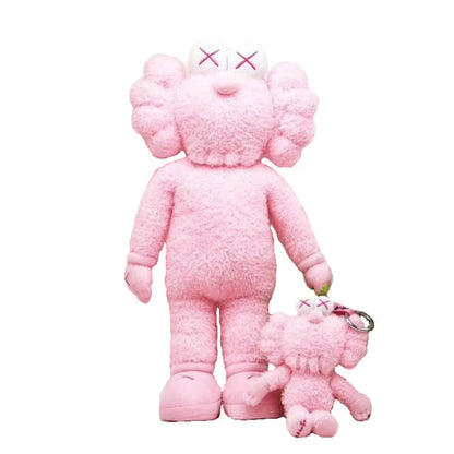 Rosa Plüschfigur mit kleinerem Schlüsselanhänger, Kunstspielzeug, Sammlerstück, modern.