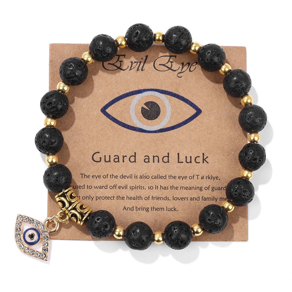 Schwarzes Lavastein-Armband mit goldenen Perlen und Auge-Anhänger, Schutz und Glück.