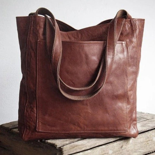 Braune Ledertasche, Umhängetasche, Vintage-Stil, handgefertigt, modisch, robust, Damenaccessoire.