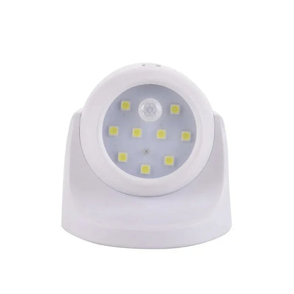 Weiße LED-Nachtlampe mit Bewegungssensor, batteriebetrieben, energiesparend, rundes Design.
