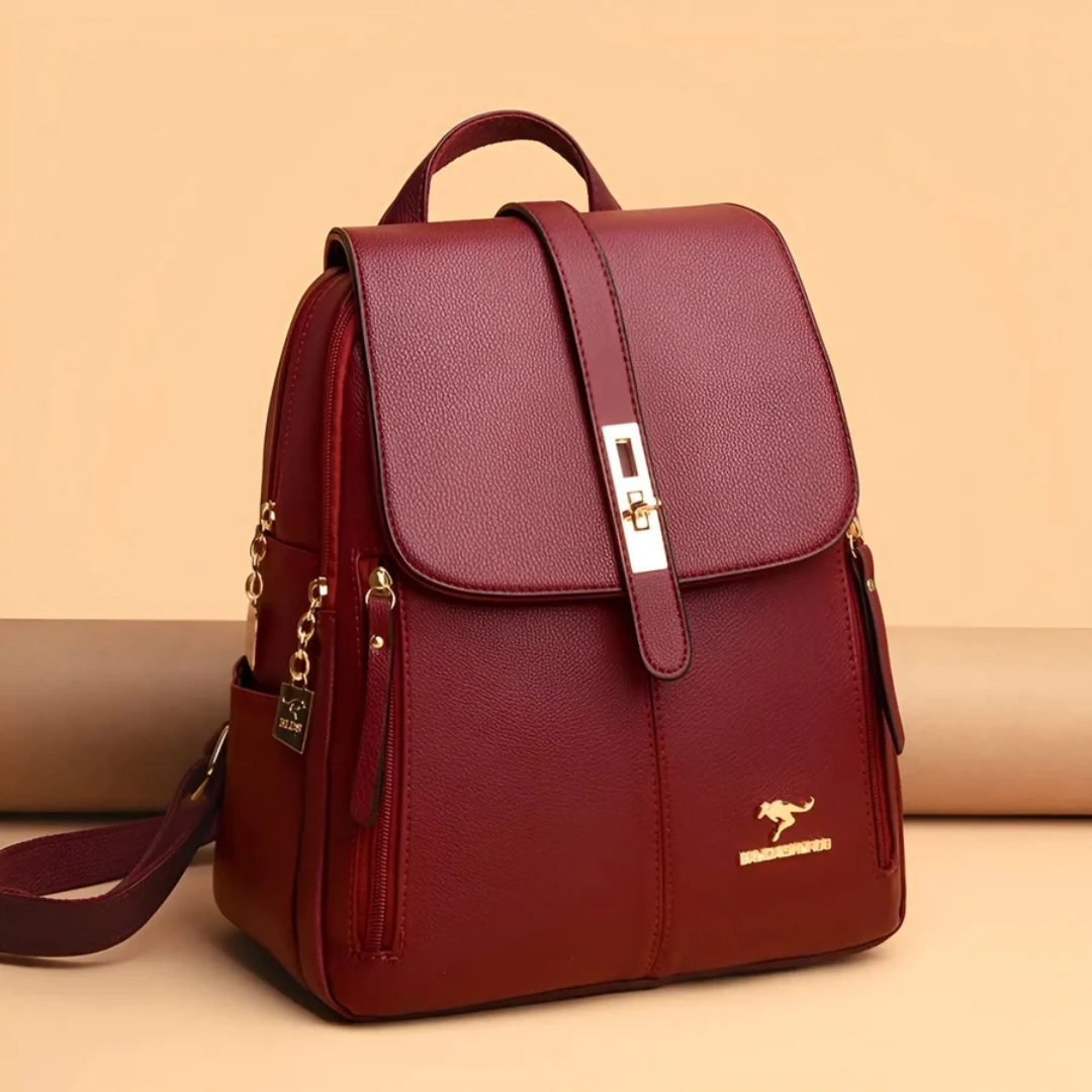 Bordeaux Damenrucksack aus Leder mit goldenen Details, modisch und elegant für den Alltag.