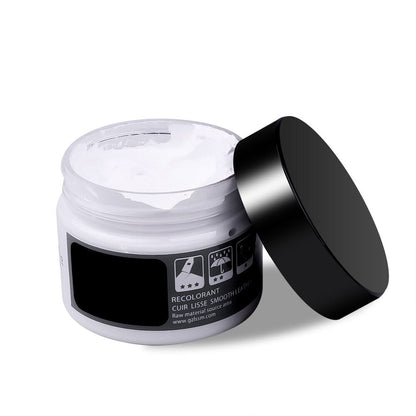 Weiße Lederpflegecreme in offenem Tiegel mit schwarzem Deckel, ideal für Glattlederreparatur.
