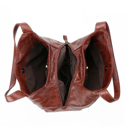 Braune Lederhandtasche mit zwei Fächern, Reißverschluss, modisch, Damenaccessoire.