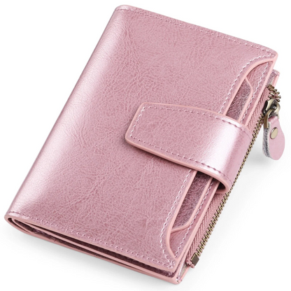 Rosa Leder-Geldbörse mit Reißverschluss und Druckknopf, elegant und kompakt.
