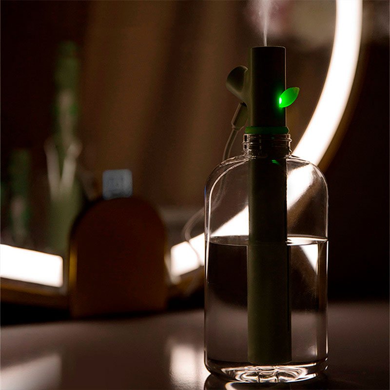 Grüner Luftbefeuchter in Flaschenform, modernes Design, LED-Licht, für Zuhause oder Büro.