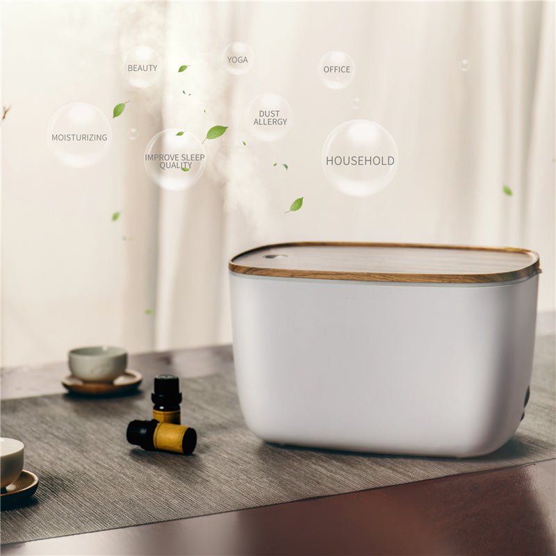 Moderner weißer Luftbefeuchter mit Holzdeckel auf Tisch, ideal für Haushalt und Büro.