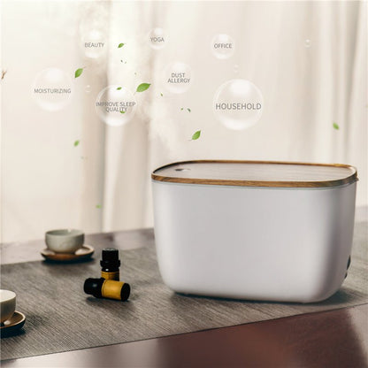 Moderner weißer Luftbefeuchter mit Holzdeckel auf Tisch, ideal für Haushalt und Büro.