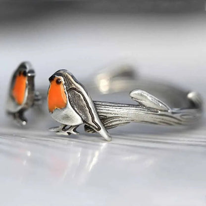 Silberner Vogelring mit Rotkehlchen-Design, handgefertigt, einzigartiger Schmuck, Geschenkidee.
