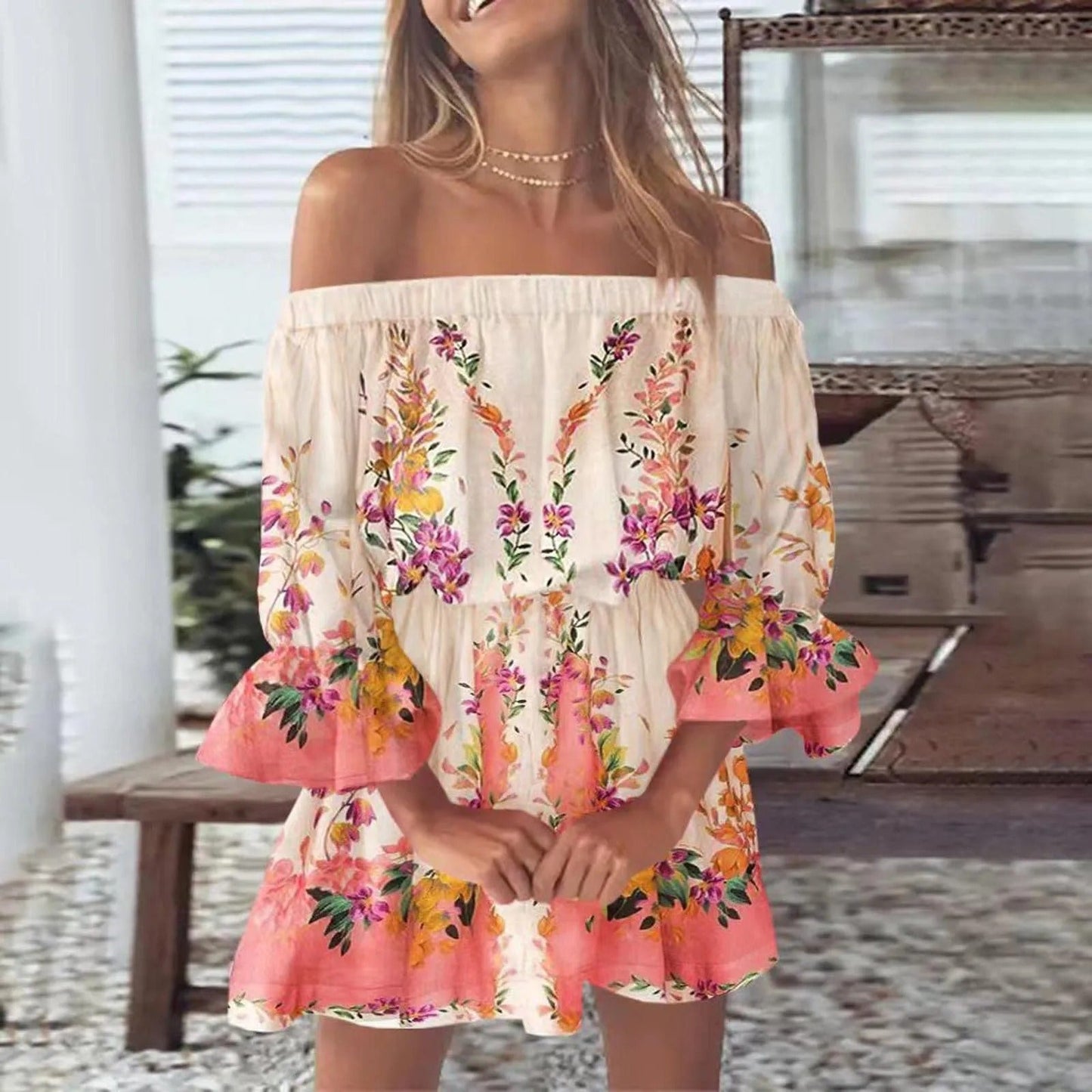 Sommardress med blommönster och utsvängda ärmar – Mireille
