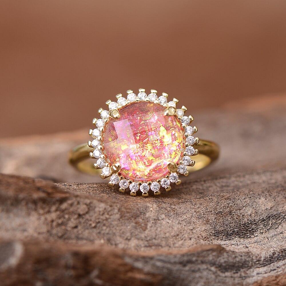 Goldener Ring mit rosa Opal und Zirkonia, verstellbar, elegantes Schmuckdesign.