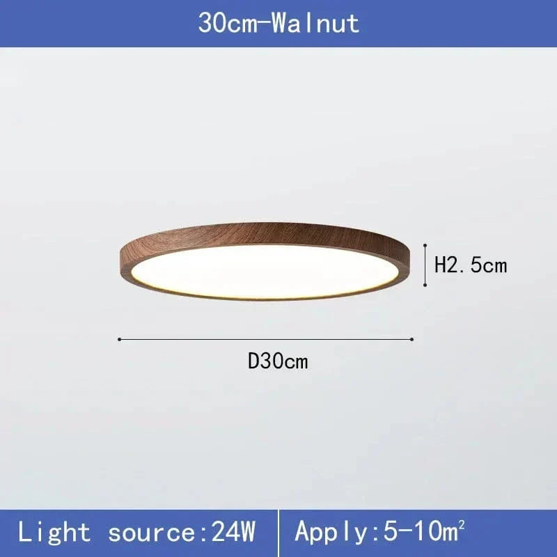 Lampa i mörk valnötston med angivna mått för 30 cm diameter och 2,5 cm höjd samt effekt och rumsyta. 7