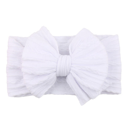 Weißes Baby-Stirnband mit großer Schleife, weiches Baumwollmaterial, modisches Accessoire.