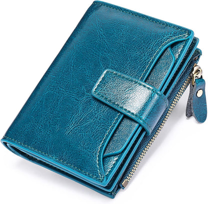 Blaue Leder-Geldbörse mit Reißverschluss und Druckknopf, stilvoll und kompakt.