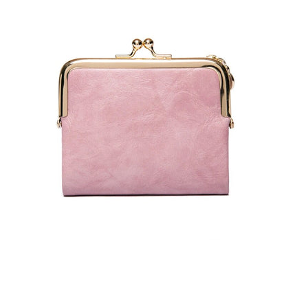 Rosa Damen-Geldbörse aus Leder mit goldfarbenem Verschluss, stilvoll und elegant.
