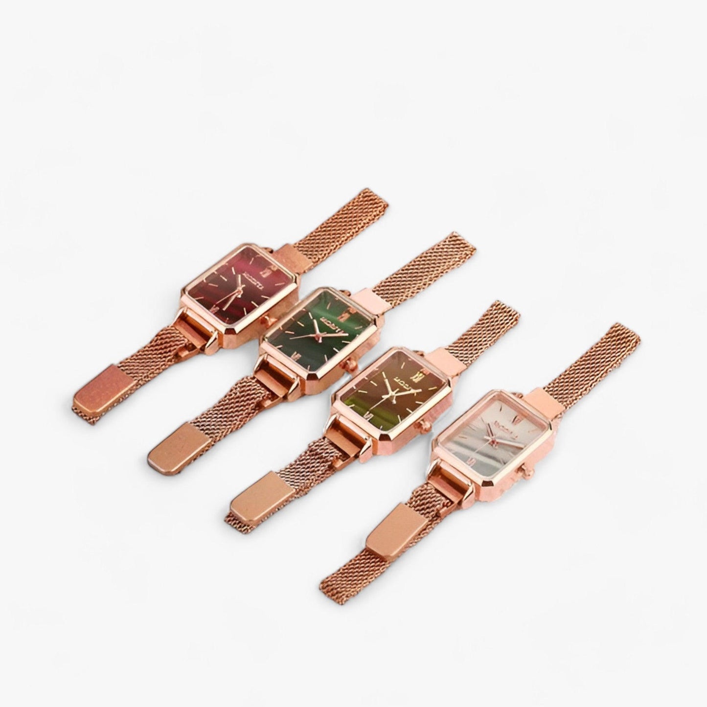 Vier rechteckige Damenuhren mit roségoldenem Mesh-Armband und verschiedenfarbigen Zifferblättern.
