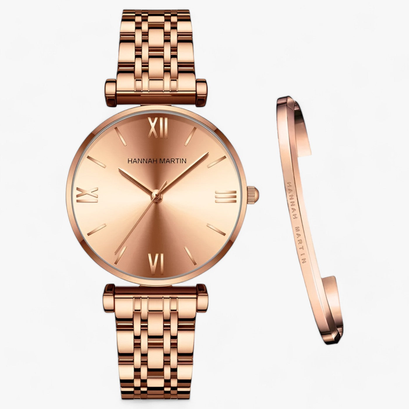 Roségoldene Armbanduhr mit Gliederarmband und passendem Armreif, römische Ziffern, elegant.