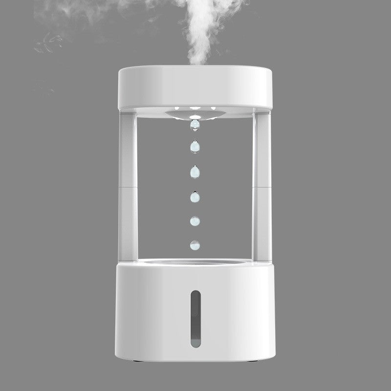 Tragbarer weißer Mini-Luftbefeuchter, modernes Design, ideal für Zuhause oder Büro.