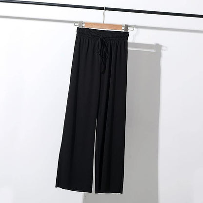 Schwarze Damenhose, locker geschnitten, elastischer Bund, Kordelzug, lässige Mode.