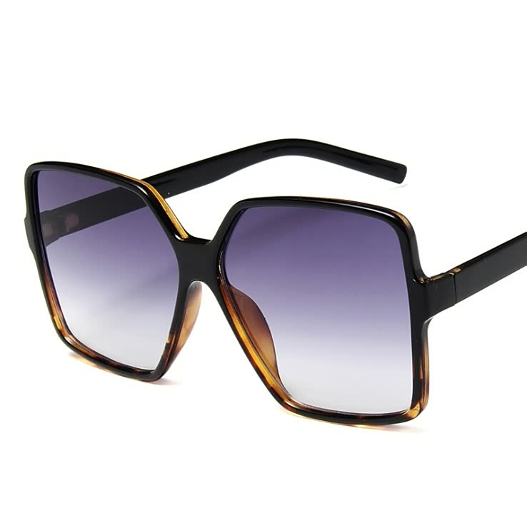 Schwarze übergroße Sonnenbrille, eckig, UV-Schutz, modisch, Damenaccessoire.