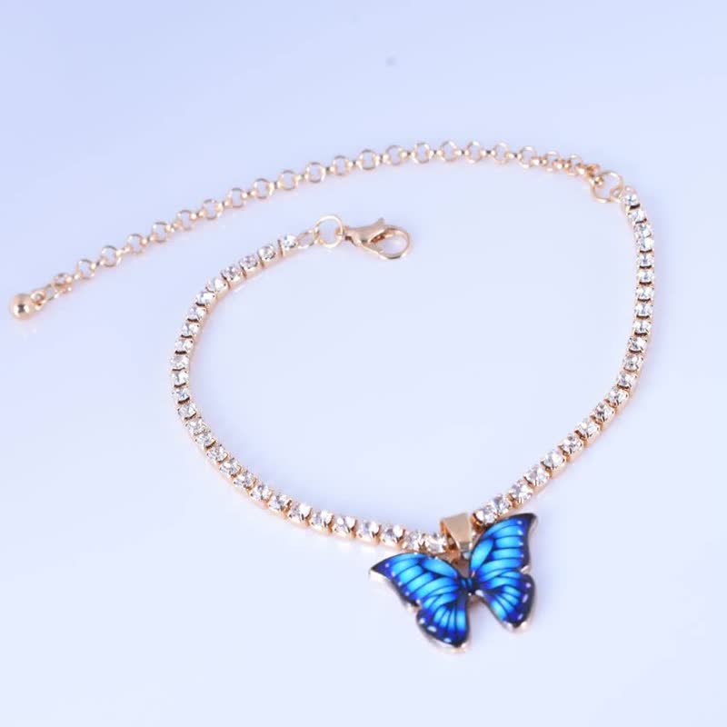 Goldenes Armband mit blauer Schmetterlingsanhänger, Kristallsteine, Damen Schmuck, elegant.