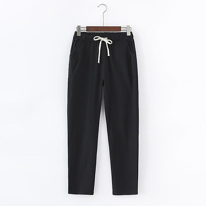 Schwarze Jogginghose mit weißem Kordelzug, bequem, sportlich, Baumwolle, Unisex.