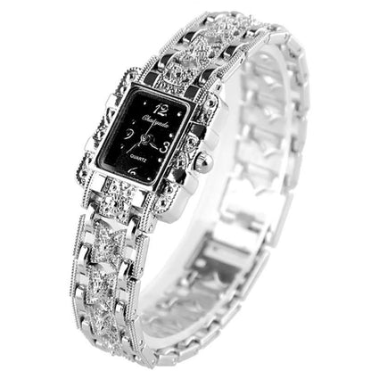 Luxus Damenarmbanduhr, silber, rechteckiges Zifferblatt, Strasssteine, elegantes Design.