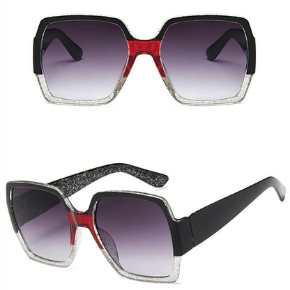 Schwarze eckige Sonnenbrille mit rotem und silbernem Glitzerrahmen, UV-Schutz, modisch.