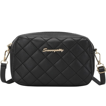 Schwarze gesteppte Umhängetasche aus Leder mit goldenen Details und verstellbarem Riemen.