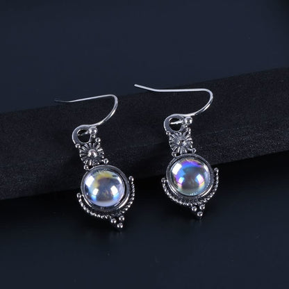 Silberne Ohrringe mit schimmerndem Mondstein, filigranes Design, Schmuck für Damen.