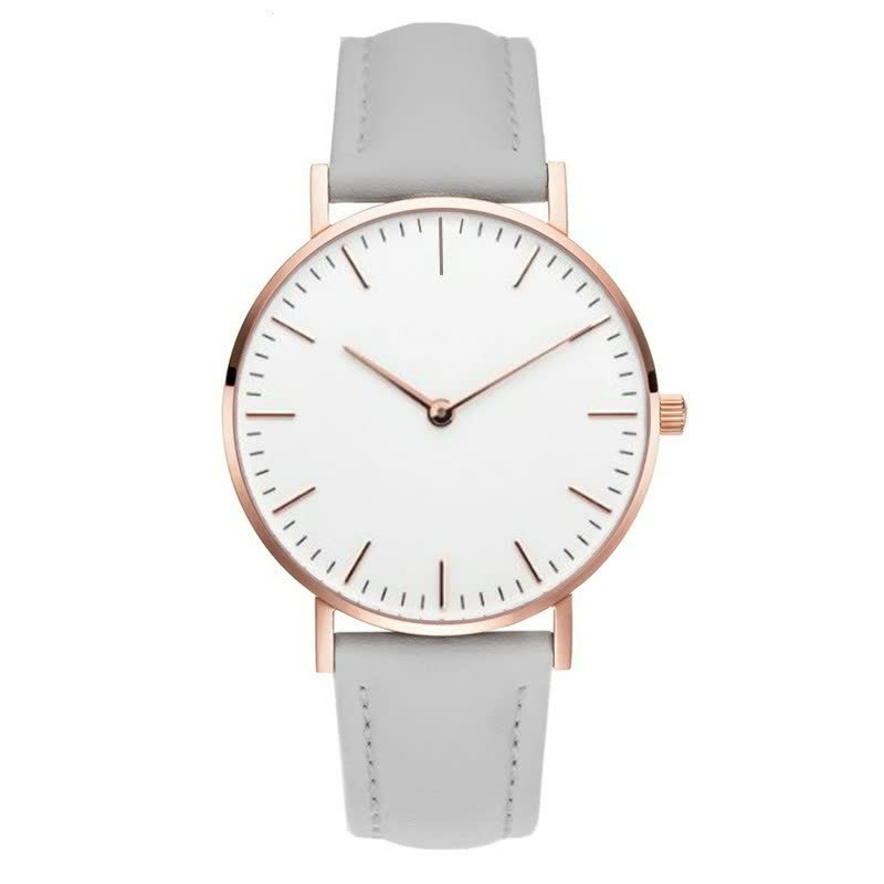 Minimalistische Armbanduhr mit weißem Zifferblatt, roségoldenem Gehäuse und grauem Lederarmband.