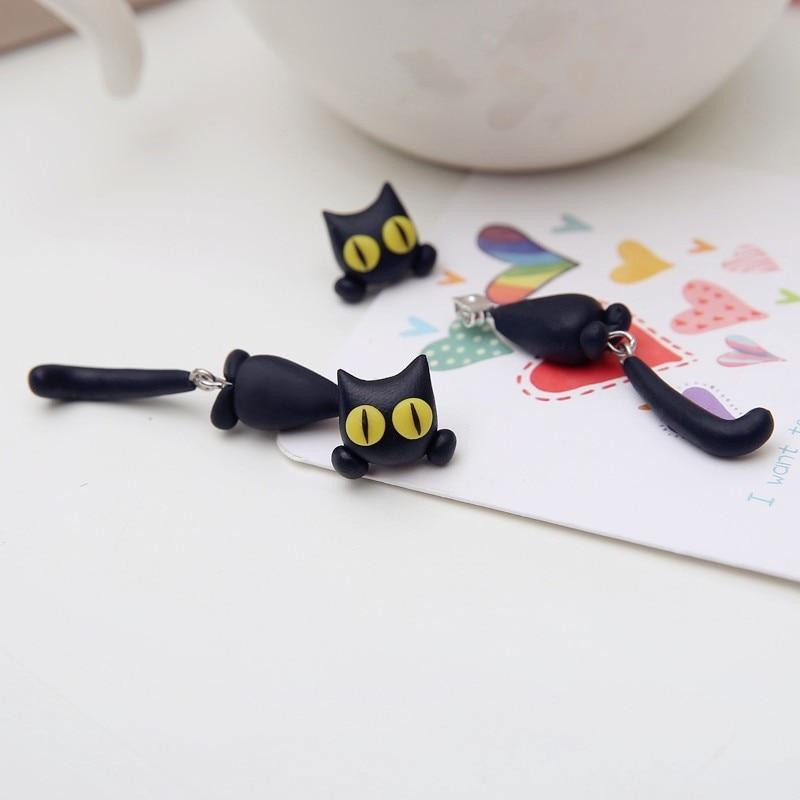 Schwarzer Katzen-Handyanhänger, niedliches Design, gelbe Augen, Geschenkidee, Smartphone-Zubehör.