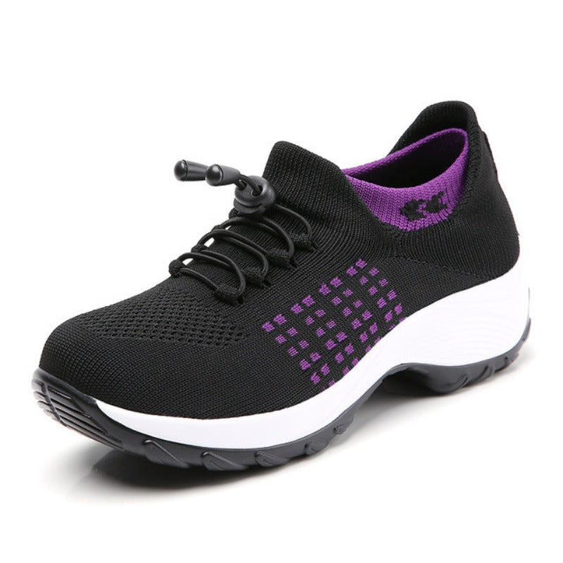 Schwarzer Damen-Sneaker mit lila Akzenten, atmungsaktiv, rutschfeste Sohle, sportlich.