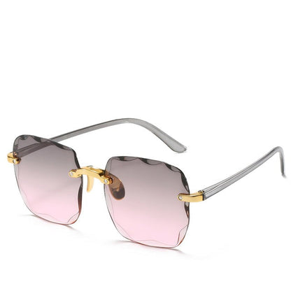 Trendiga randlösa solglasögon med UV400-skydd i vintage-look – Clea