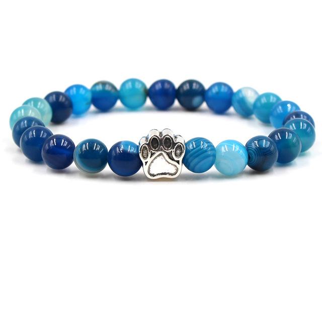 Armband mit blauen Perlen und silbernem Pfotenanhänger, elastisch, modisch, Unisex-Schmuck.