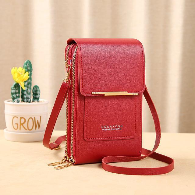 Rote Damenhandtasche aus Leder mit Schulterriemen, modisch und elegant, ideal für unterwegs.