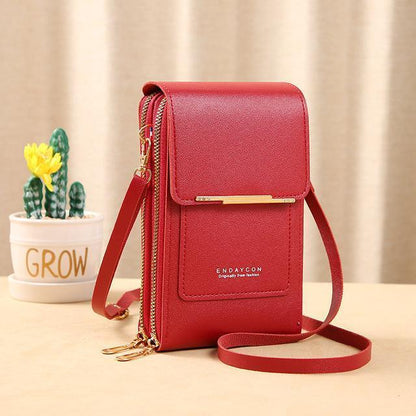 Rote Damenhandtasche aus Leder mit Schulterriemen, modisch und elegant, ideal für unterwegs.