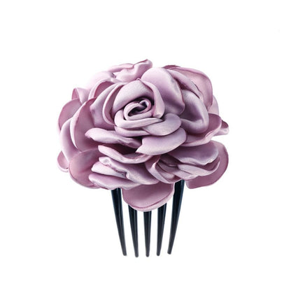 Rosa Haarblume aus Satin auf schwarzem Kamm, elegantes Accessoire für Hochzeiten.
