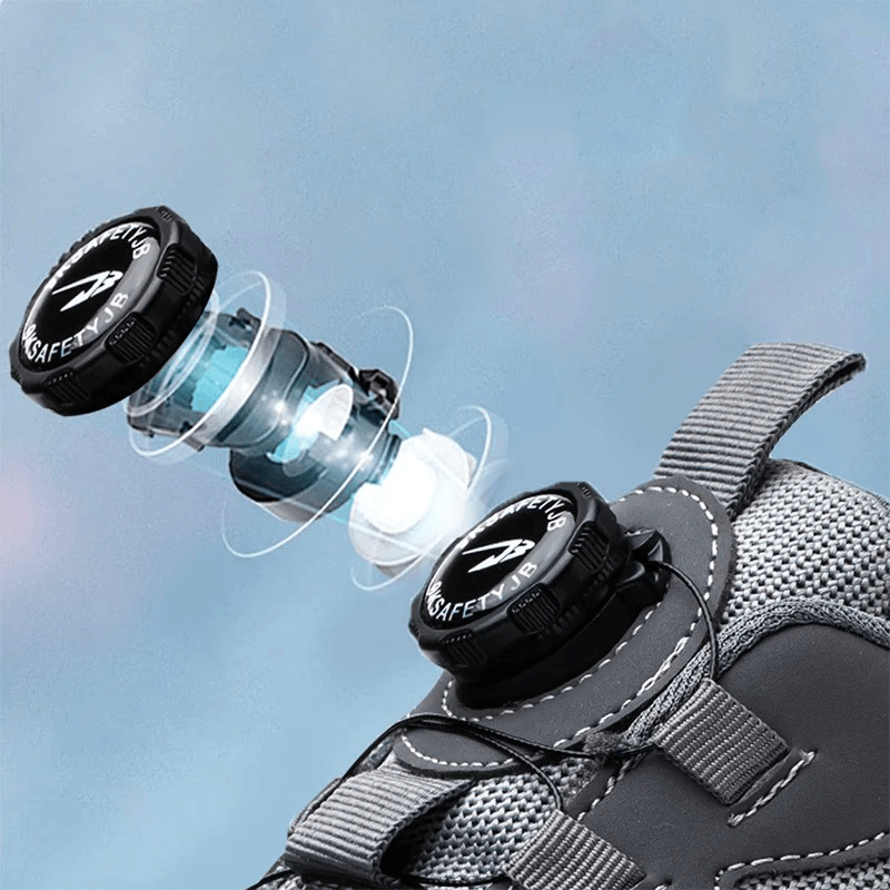 Grauer Sicherheitsschuh mit innovativem Verschlusssystem, ergonomisch, rutschfest, robust.