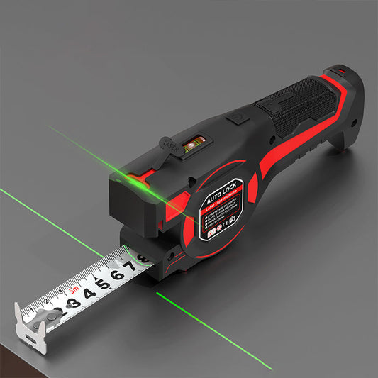 Rött och svart måttband med utdragen tejp och gröna laserlinjer som projiceras över en grå yta 1