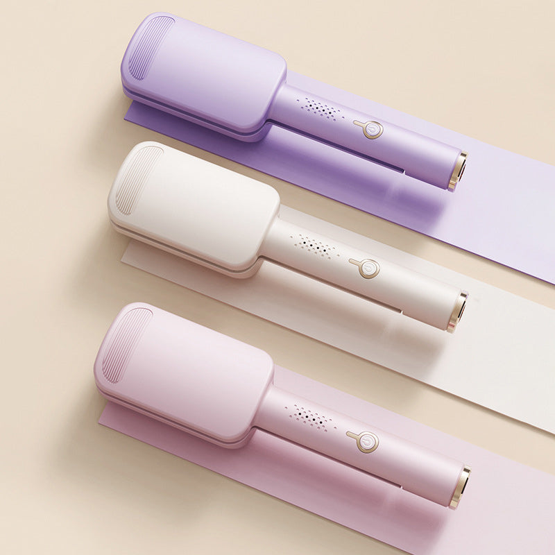 Tre vågtänger i lila, beige och rosa ligger ovanifrån på pappersremsor i matchande färger 2