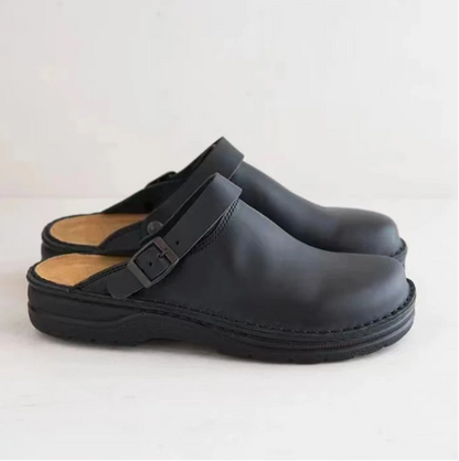 Schwarze Leder-Clogs mit verstellbarem Riemen, bequeme Schuhe für Damen und Herren.