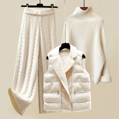Weiße Damen Wintermode: Strickpullover, Steppweste, Strickhose, elegant und warm.