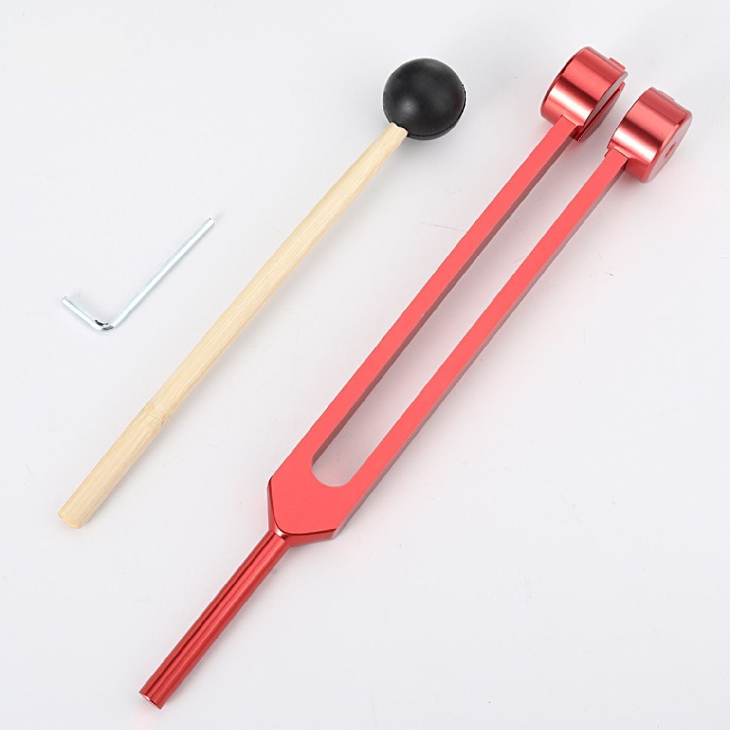 Rotes Stimmgabel-Set mit Holzklöppel und Schraubenschlüssel, Musiktherapie-Instrument.