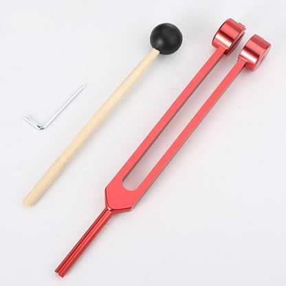 Rotes Stimmgabel-Set mit Holzklöppel und Schraubenschlüssel, Musiktherapie-Instrument.