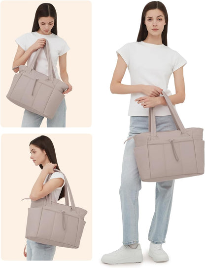 Vadderad puffer-tote med mugghållare och laptopfack för resor och arbete.