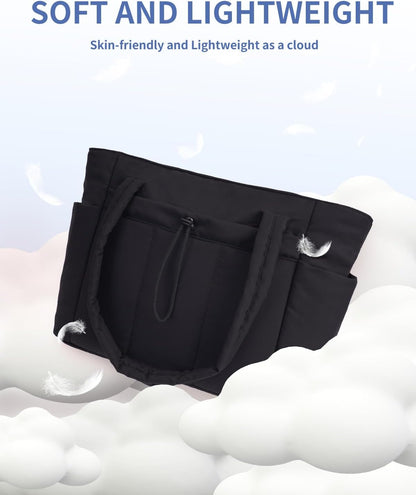 Vadderad puffer-tote med mugghållare och laptopfack för resor och arbete.