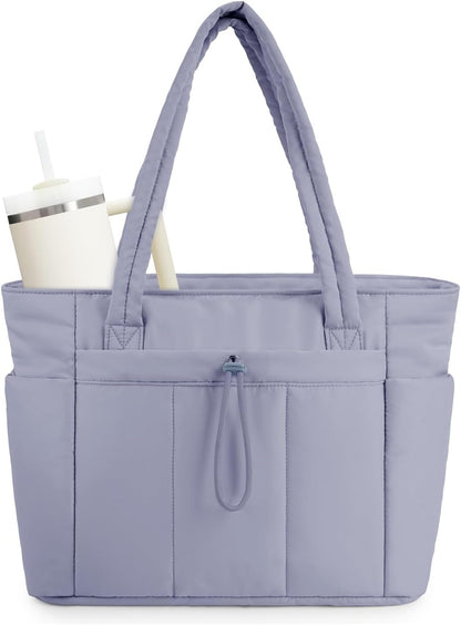 Vadderad puffer-tote med mugghållare och laptopfack för resor och arbete.
