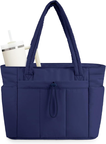 Vadderad puffer-tote med mugghållare och laptopfack för resor och arbete.