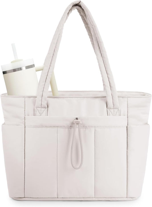 Vadderad puffer-tote med mugghållare och laptopfack för resor och arbete.