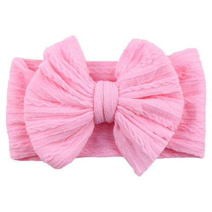Rosa Baby-Stirnband mit großer Schleife, weiches Baumwollmaterial, modisches Accessoire.